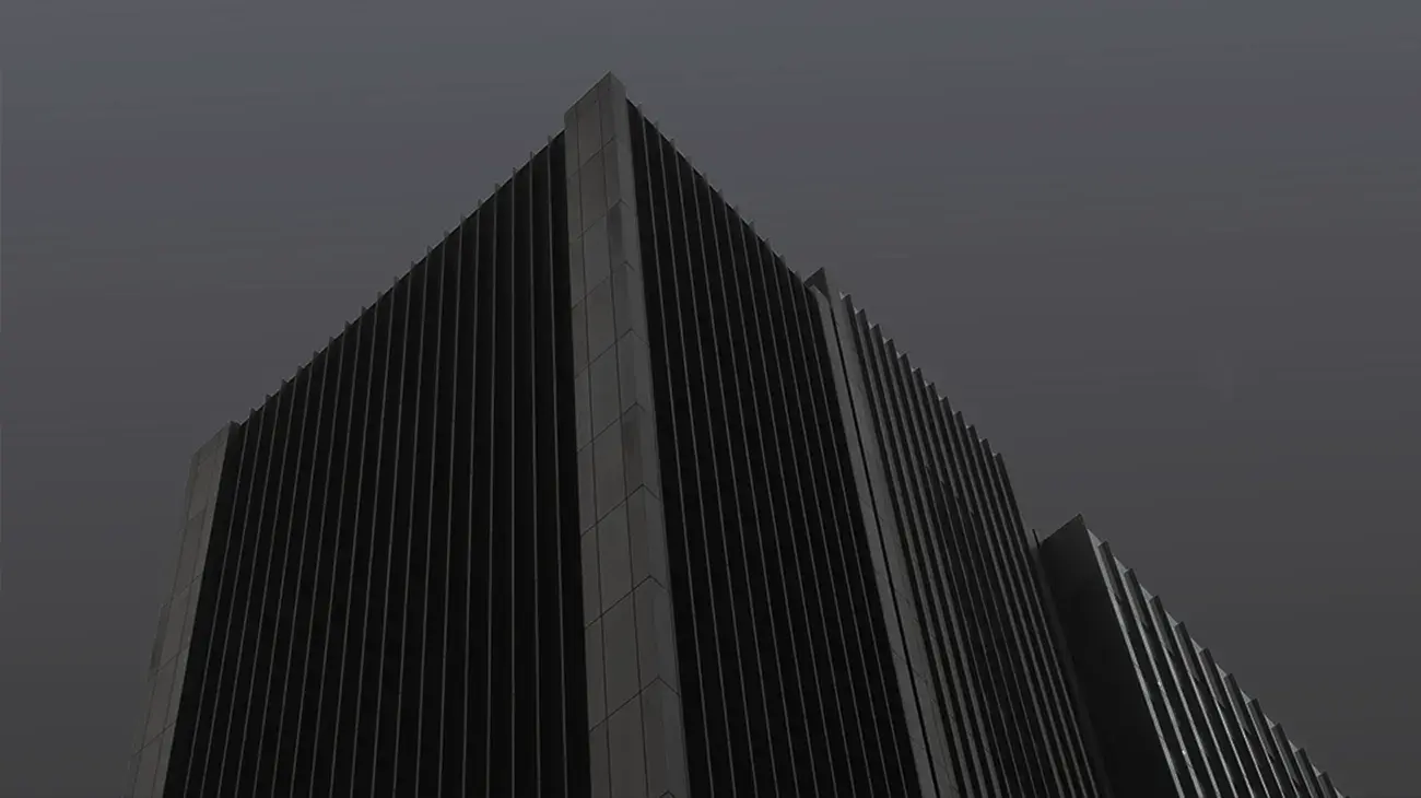 Dark image of a tall skyscraper with many windows